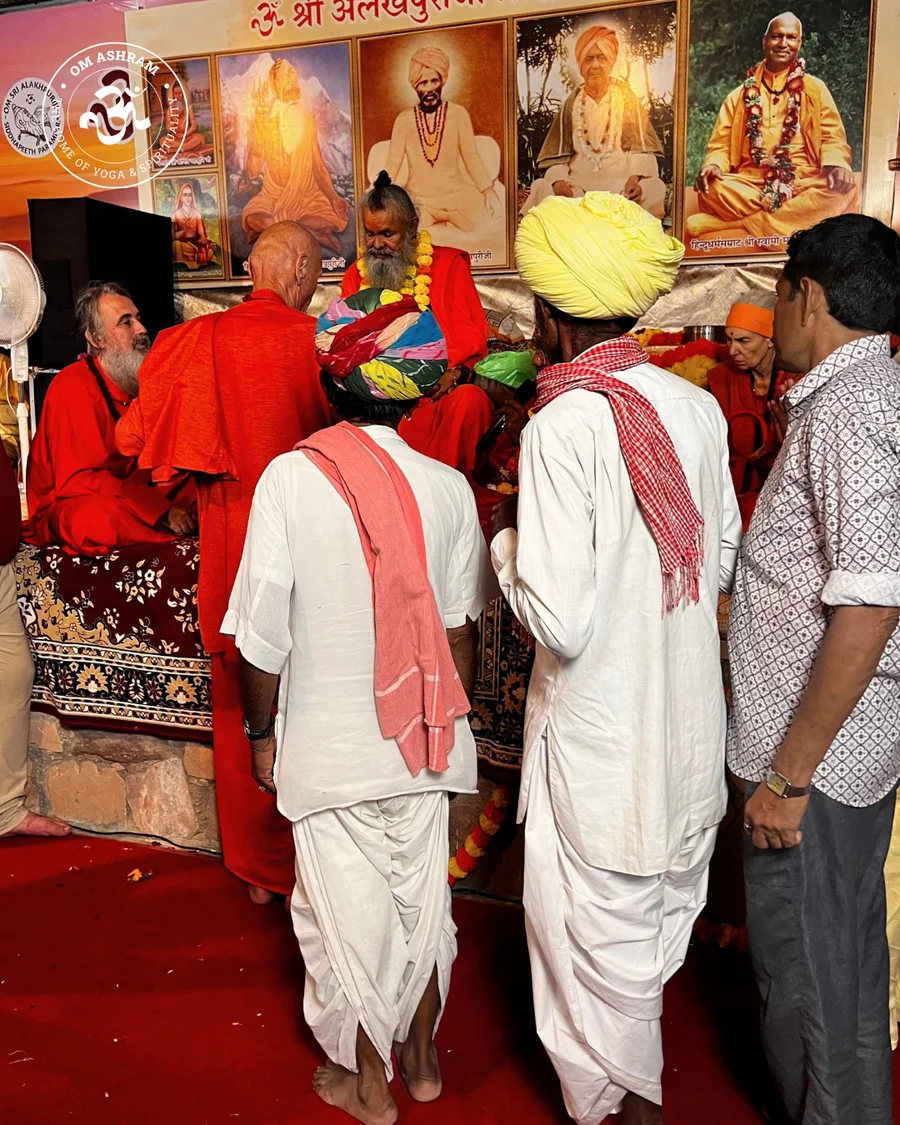 Men in traditional dhotis and kurtas queuing for blessings.